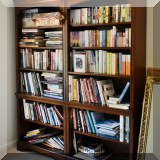 F43. Two-piece solid wood bookcase. 79”h x 64”w x 14.5”d
